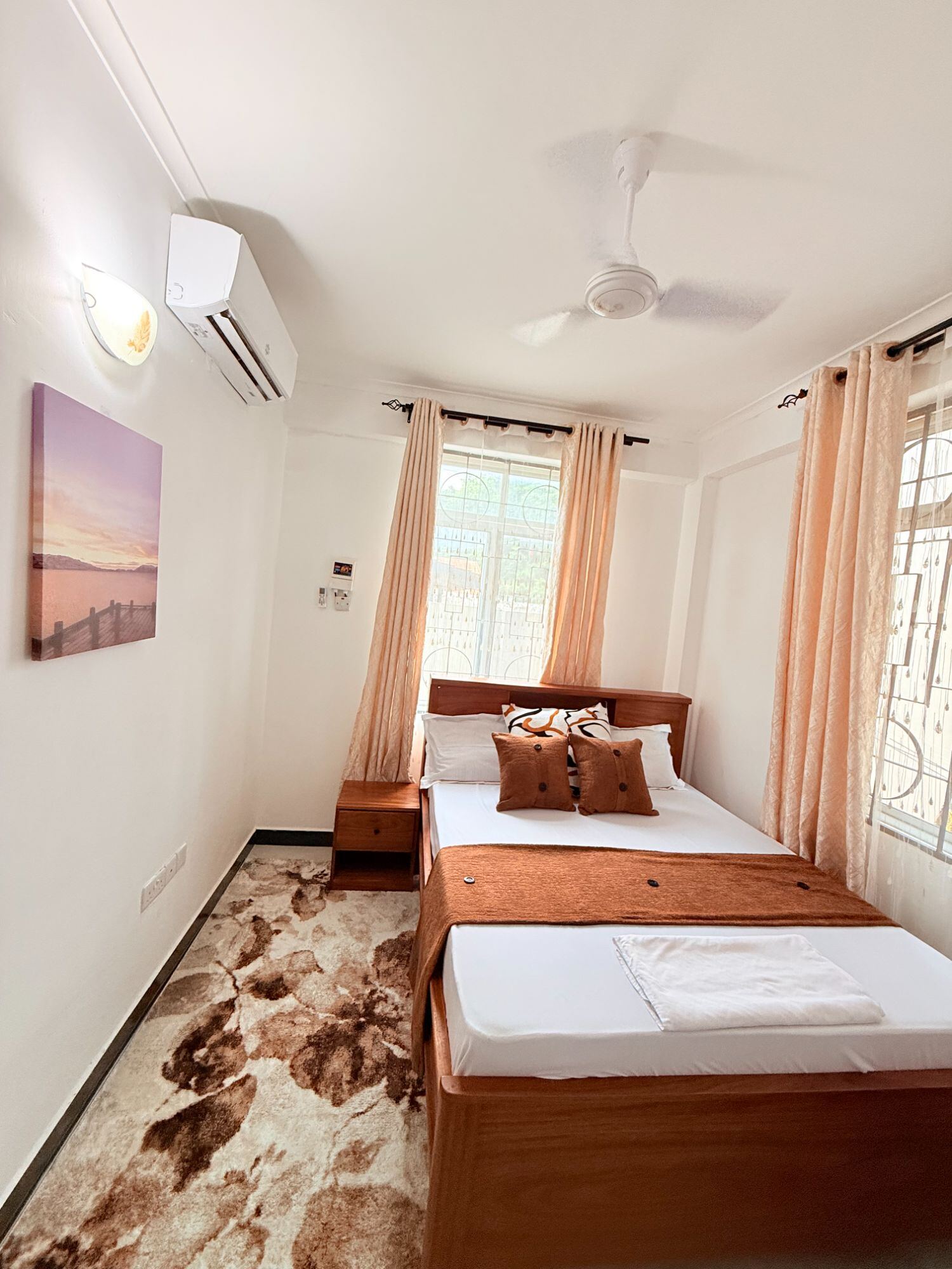 Mikocheni bedroom with queen bed