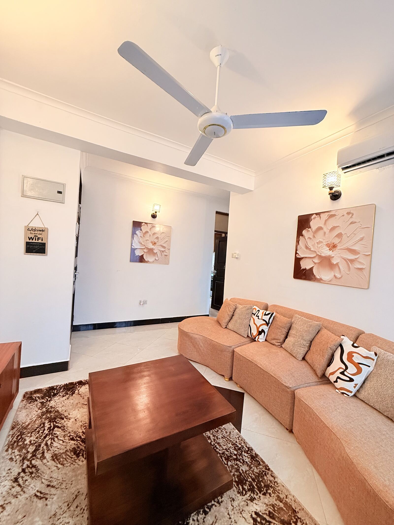 Mikocheni living room with ceiling fan